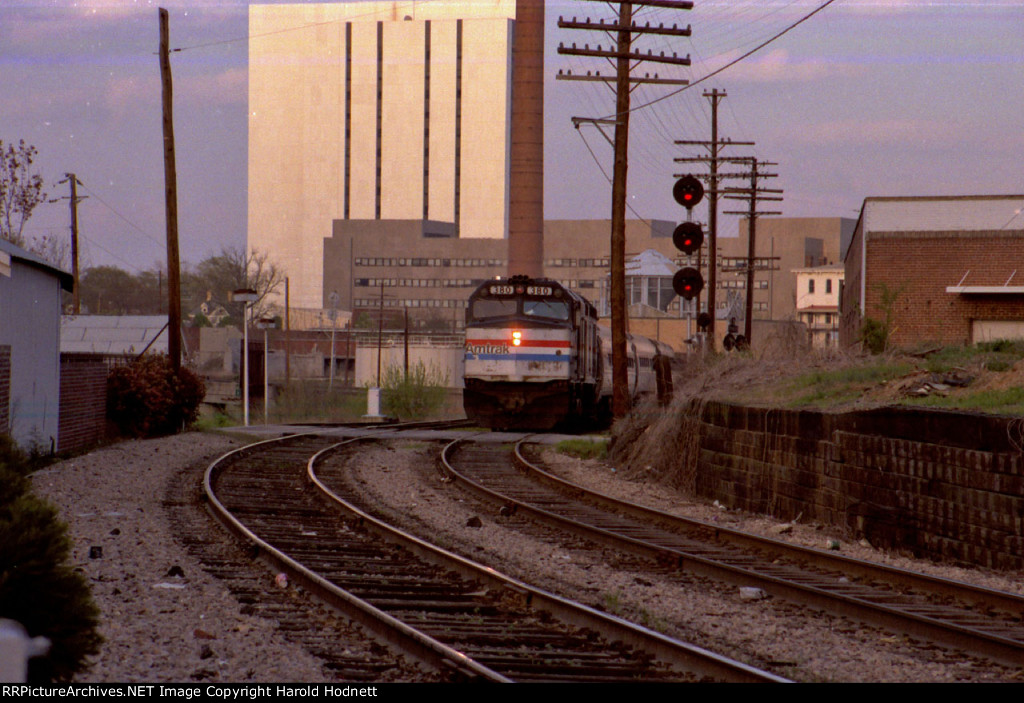 AMTK 380 leads a train southbound